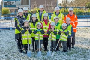 Pupils and officials gather to mark the start of work on new nursery