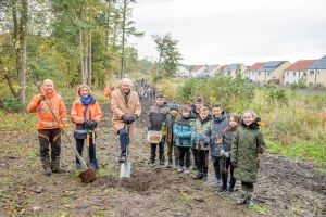 Council Leader Lawrence Fitzpatrick plants a tree to mark country park's half century