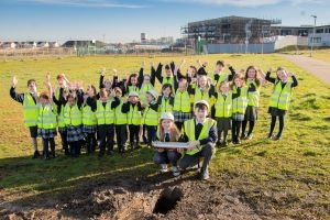 Pupils from Calderwood placing a time capsule 