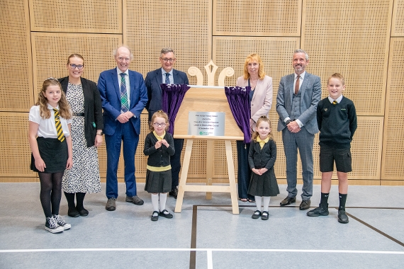 Pupils, staff and invited guests with the plaque to mark the official opening of the new East Calder Primary