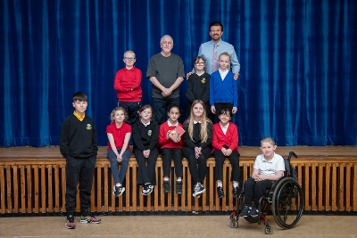 Composer Patrick Doyle with staff and pupils from Blackburn and Murrayfield primaries