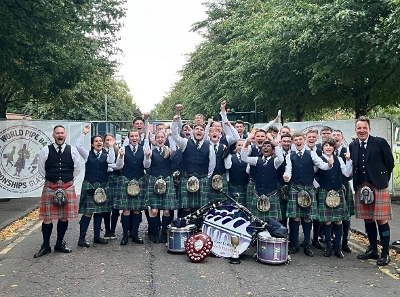 Band members with their World Champions trophy.